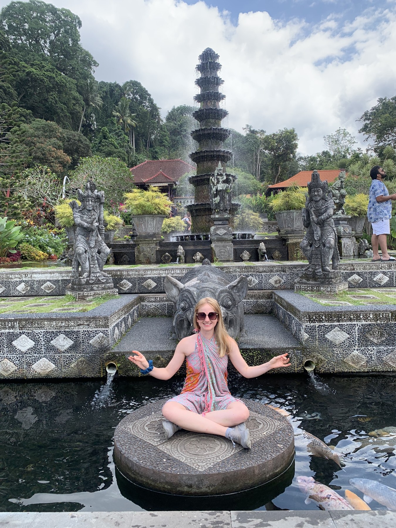 Georgia in meditation beside a temple fountain in Bali